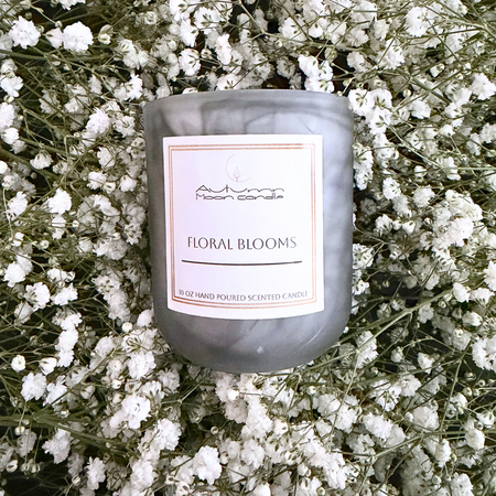 Autumn Moon Candle Floral Blooms  10oz candle sitting in flowers