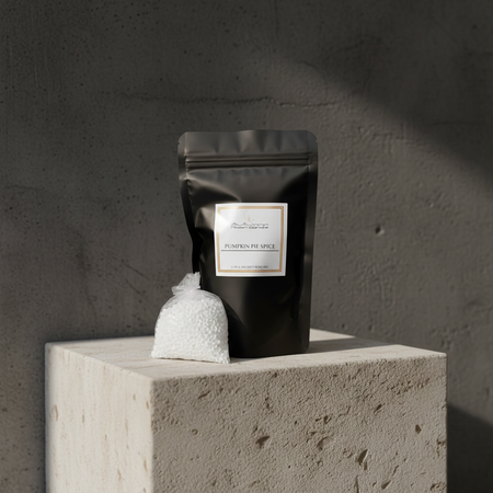 Autumn Moon Candle Pumpkin pie spice sachet in black bag sitting on stone pedestal