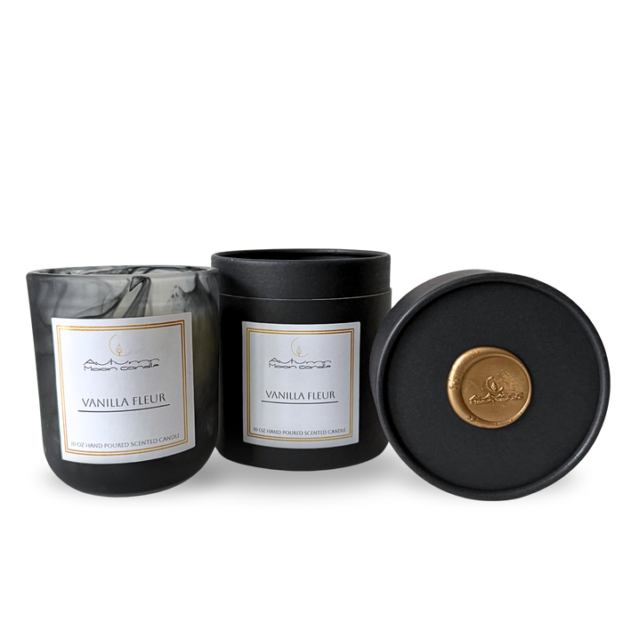 Autumn Moon Candle Vanilla Fleur 10 oz luxury hand poured candle with a black gift box. Luxury candle in reusable black glass vessel