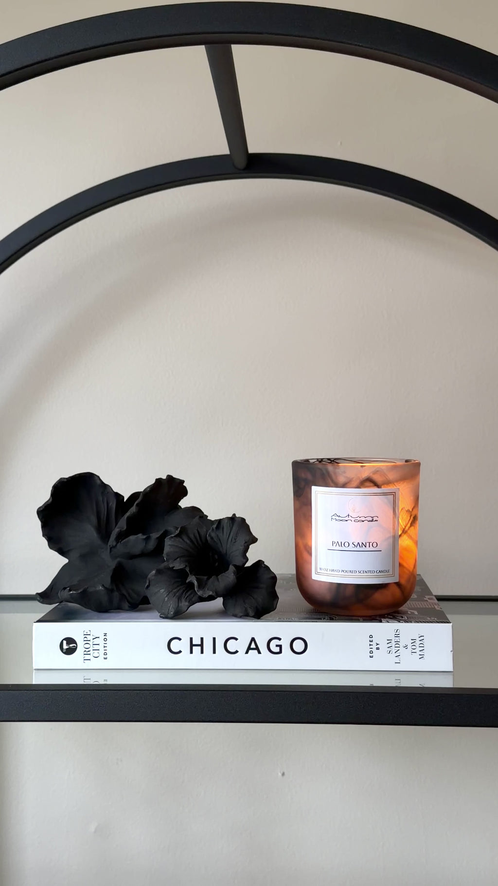 Autumn Moon Candle 10oz Candle lit on glass shelf